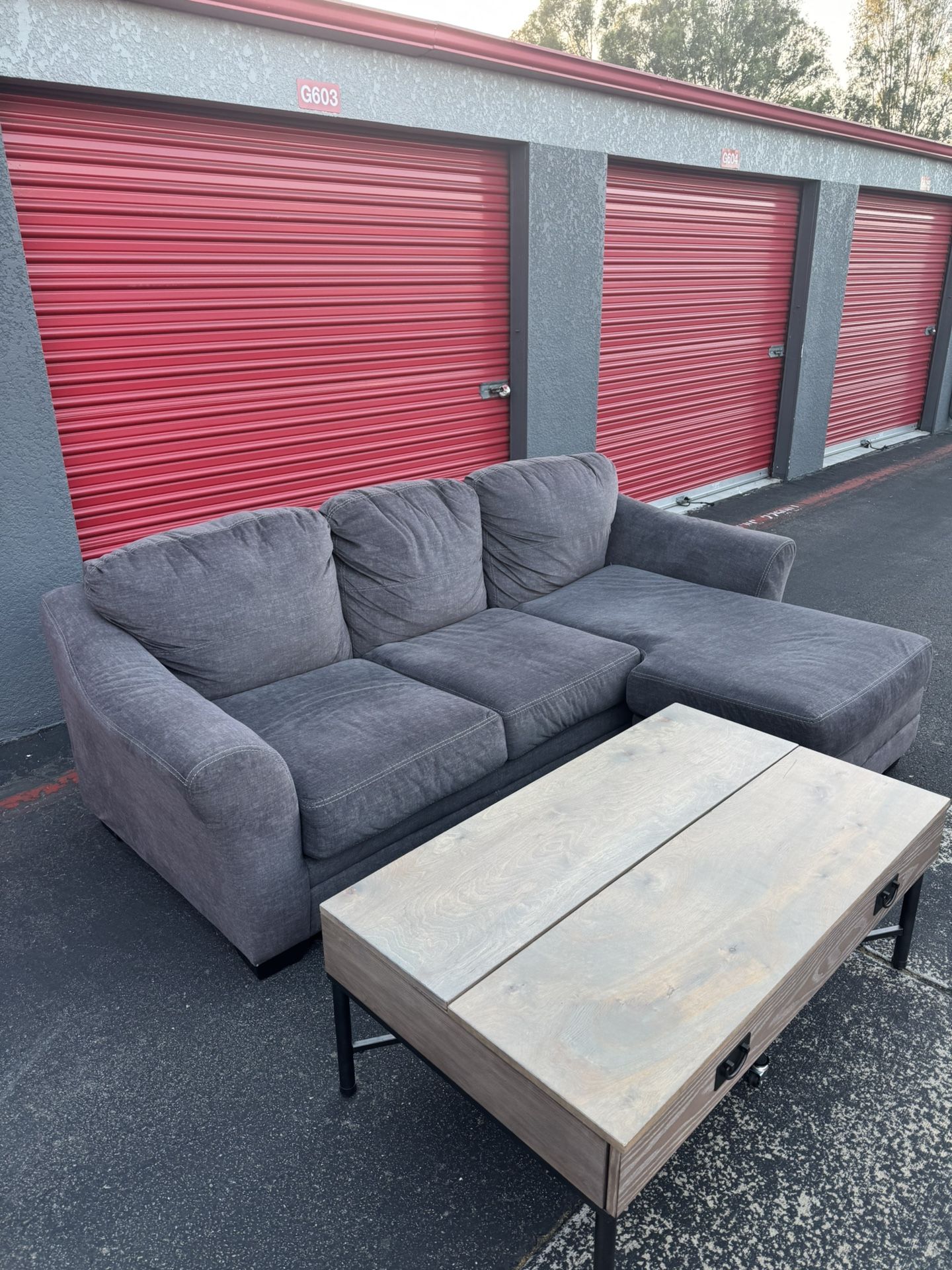 Ashely Furniture Reversible Grey L Couch (FREE DELIVERY) with coffee table