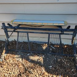 Metal Rack With Light Bar. 