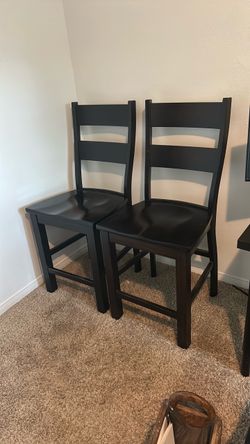 2 brown maple onyx wood chairs,