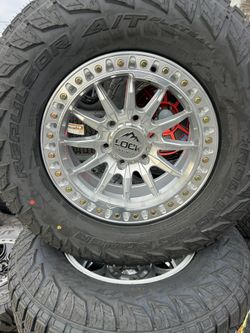 17x8.5. LOCK OFF ROAD WHEELS 285/70/17 TIRES