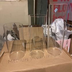 Tons of hurricane vases for wedding see description