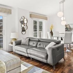 Dark grey leather reclining loveseat - damage to sides and back only