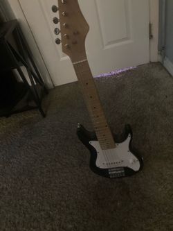 Mini black and white electric guitar
