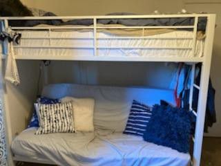 White metal twin bunk with full futon bed or sofa below