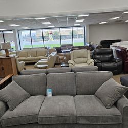 Gray fabric sofa with toss pillows