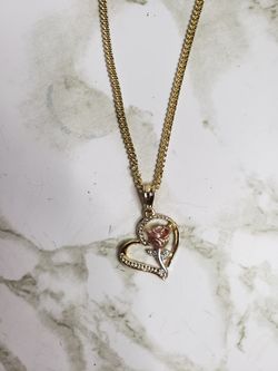 Gold chain with charm
