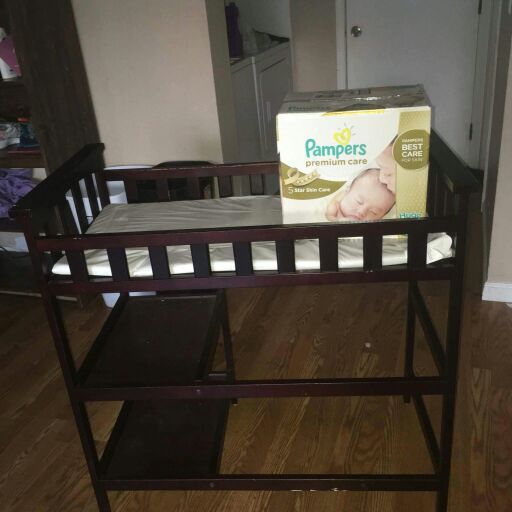 The Pampers newborn premium diapers are sold but the Espresso changing table is still available