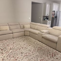 Cream Comfortable & Reclining Sectional (with Charging Station) + TV Stand + Coffee Table (not pictured)