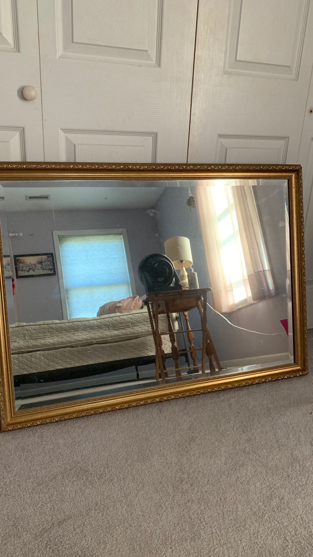 Wall mirror with gold border