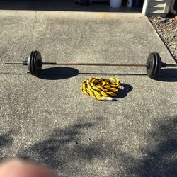 185  pound barbell set/w  7  ft  bar and  25 climbing  rope