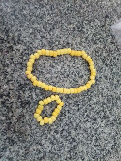 Matching yellow necklace and bracelet.