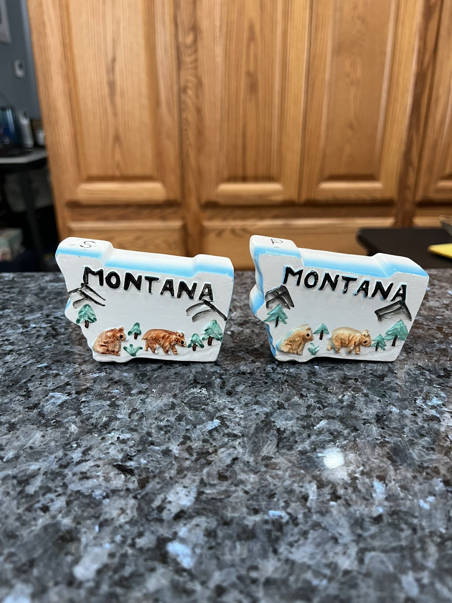 Ceramic Montana  State Pair of Salt And Pepper Shakers.  Preowned.  Has been on display in a cabinet with a very large salt and pepper shakers collect