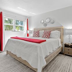 King bed with night stands and chest.