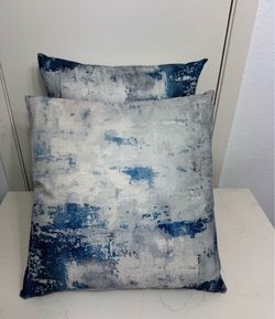 2 blue pillows