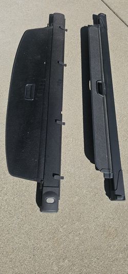 The object in the image is a BMW X7 G07 Rear Parcel Shelf Load Cover,