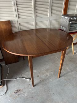 Wood table with folding sides
