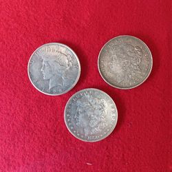 Silver Dollars 2 Morgan's And 1 Peace Dollar 