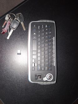 Wireless mini keyboard with rolling mouse