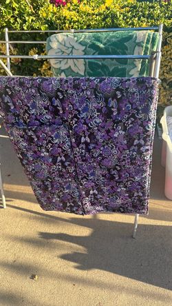 Handmade quilted textile in purple and black tones with geometric pattern