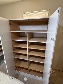 White Storage Cabinet with Multiple Shelves