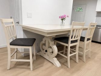Extended dining table with chairs
