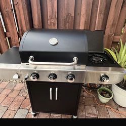 BBQ Gas Grill with 3 burners and side burner.