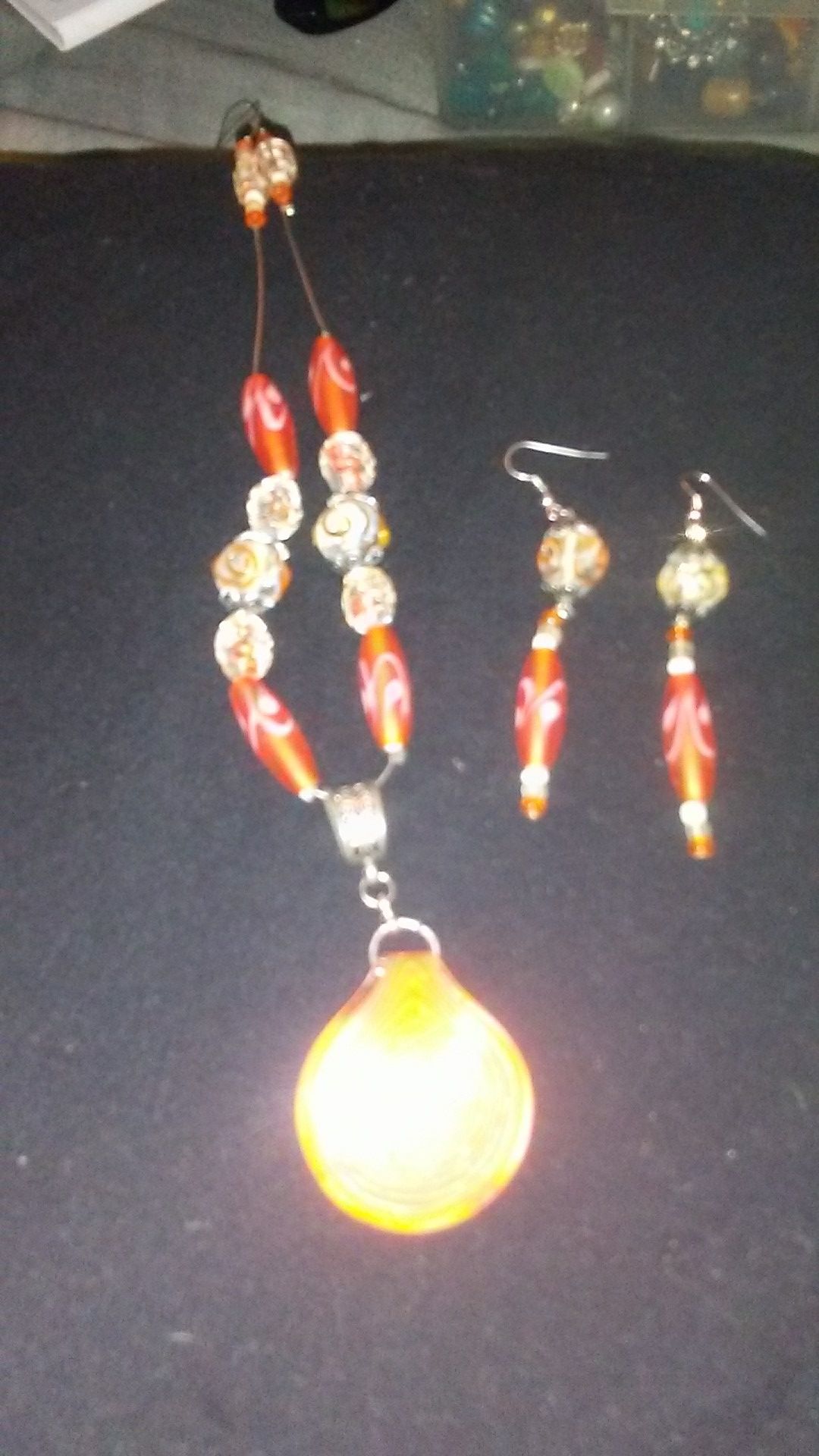 Handcrafted orange glass necklace and earring set