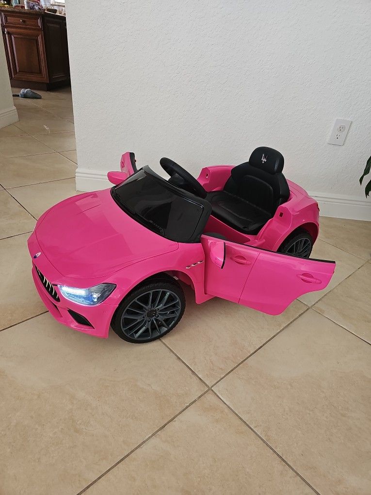 Electric car Maserati with charger. Plays music.
