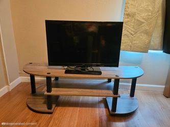 TV stand with TV included