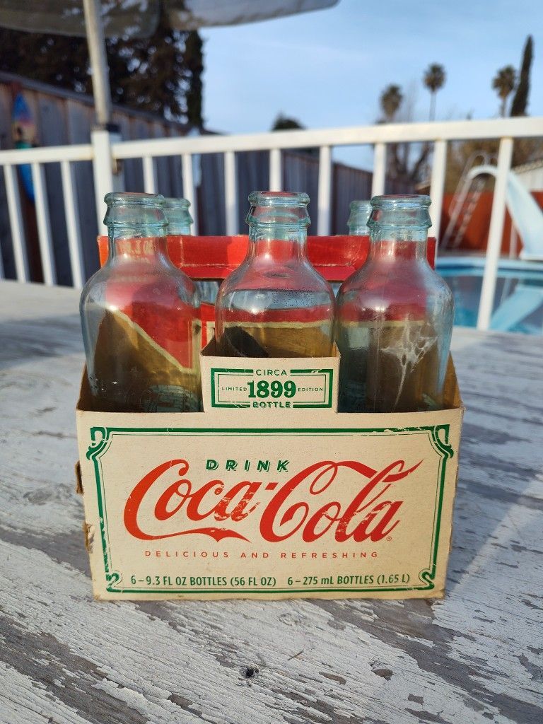Six Pack Of Coke Bottles $10.