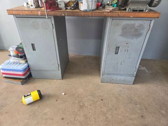2 cabinet work bench. Solid top bench grinder and vice included