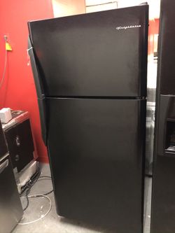 Used Frigidaire top and bottom fridge. 1 year warranty