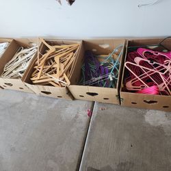 7 Boxes of Hangers – Plastic, Wood. Rubber and Velvet - Most $10/box