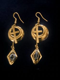 Gold-toned drop earrings feature a crescent moon and cross design. The jewelry has a polished finish and includes a diamond-shaped pendant with a clea