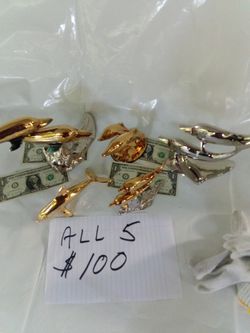 5 Multi Plated Dolphin Sculptures for $100
