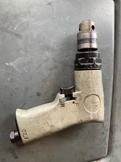Reversible air drill