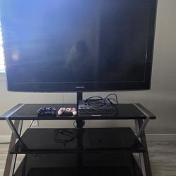 Samsung TV SS02 W/ TV Stand And Playstation 4