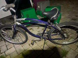 Jaguar Men’s  Cruiser Bike Blue The image shows a blue and silver Schwinn Jaguar men's 26-inch cruiser bicycle