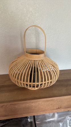 Decorative basket with candle inside
