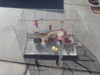 Animal cage with accessories