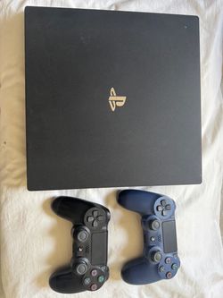 PS4 Pro and two controllers