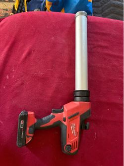 Milwaukee caulking and adhesive gun (new) + battery!!
