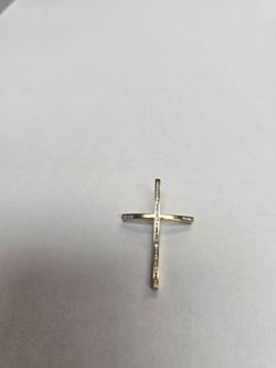 18k Gold cross pendant with diamond chips.
