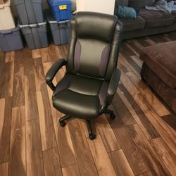 Black Serta-brand office chair. 