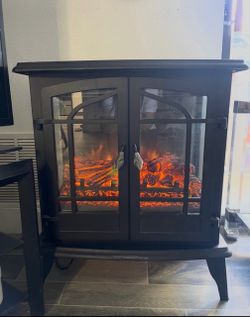 Staitionary , freestanding electric fireplace.
