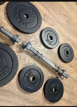 Set Of Cast Iron Standard (1.2 Inch) Dumbbells With 4 Weight Plates Of 10,  And 4 Of 5  Pounds.