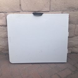 Plastic folding table with grill set up