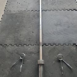 Solid 7ft 45lb Olympic Bar With Set Of Clamps..