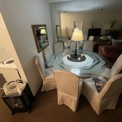 73 Inch octagonal glass top pedestal dining room table with eight chairs