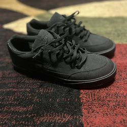 All black Nike shoes 